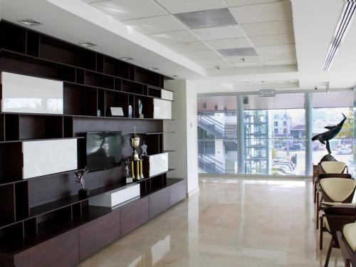 a living room with a large black entertainment wall at Holiday Inn Express Puerto Vallarta by IHG in Puerto Vallarta