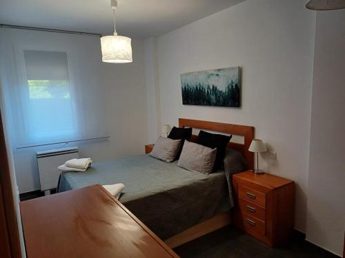 Ένα ή περισσότερα κρεβάτια σε δωμάτιο στο Xove Home Mar de Lugo