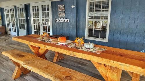 a wooden table with pumpkins on it in a room at Lake Oconee Stunning views, deep water oversized dock, fully renovated in Eatonton