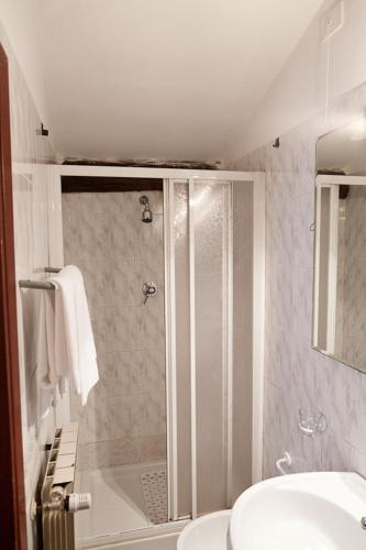 a bathroom with a shower and a toilet and a sink at Hotel Masaccio in Florence