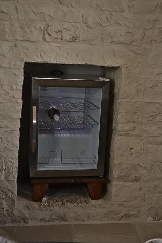 a small oven in a stone wall at Suite Dimora Antico Campanile in Locorotondo