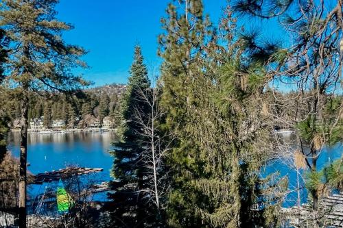 a view of a lake through the trees at Eagles Nest on Lake Arrowhead in Lake Arrowhead