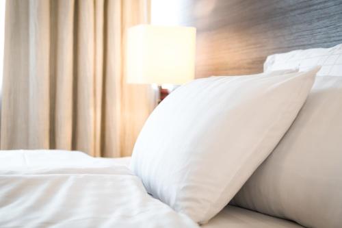 Postel nebo postele na pokoji v ubytování Torget Aparthotel