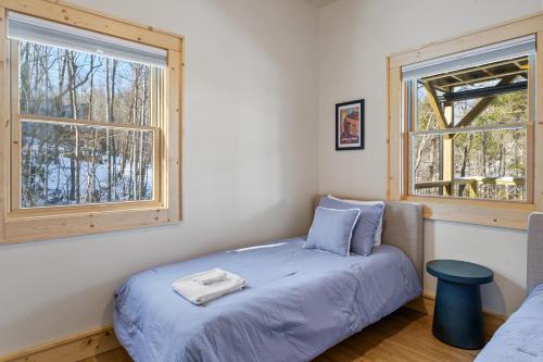 a bedroom with a bed and a window at Lorien in Fleetwood
