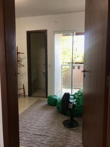 a camera is sitting on the floor of a room at Espaço Baobá Suítes Confortáveis in Camboriú
