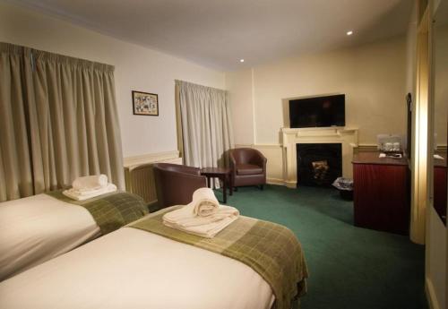 Μια τηλεόραση ή/και κέντρο ψυχαγωγίας στο New Inn Hotel
