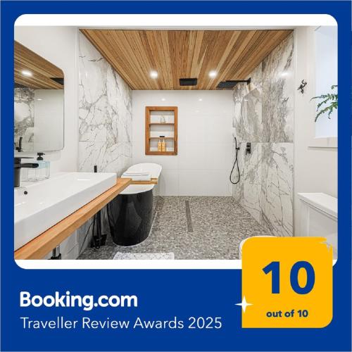 a bathroom with a tub and a sink and a shower at Downtown Oasis-2BR-Spa Bath-Pet Friendly, Free Parking in Toronto