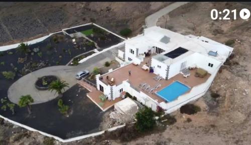 an aerial view of a large white house at Villa Feliza in Güime