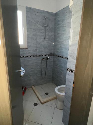 a bathroom with a shower and a toilet at Sea flavor in Shëngjin