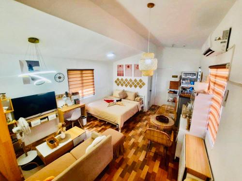 a living room with a couch and a table at Olango Island - Tiny Guest House - S&E-3 in Lapu Lapu City