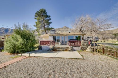 a home in the desert with a fence at 6 Mi to Lake Isabella Mountain Mesa Getaway in Mountain Mesa