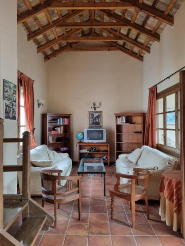 a living room with a couch and a table at El Granero de Manzanares in Manzanares