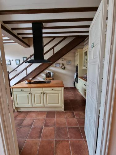a kitchen with a sink and a counter in a room at El Granero de Manzanares in Manzanares
