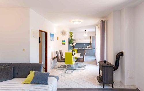 a living room with a couch and a table at Apartment Kampor 1 in Kampor