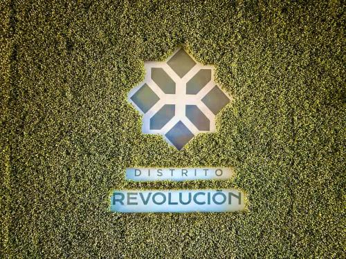 a sign that says disturb revision revision on top of sand at Downtown Tijuana 1 BR Ave Revolucion Suite 1st floor in Tijuana