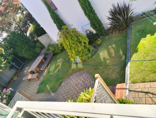 an aerial view of a house with a garden at Akaroa Village Inn in Akaroa