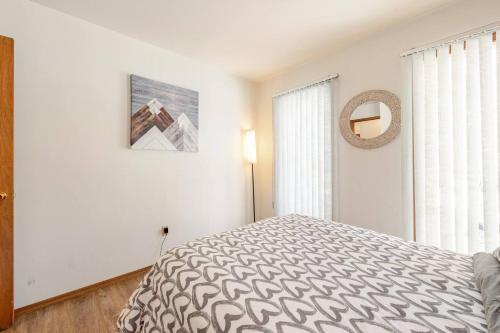 a white bedroom with a bed and a window at Cozy Cabin at Poconos With Hot Tub and Fire Pit in East Stroudsburg