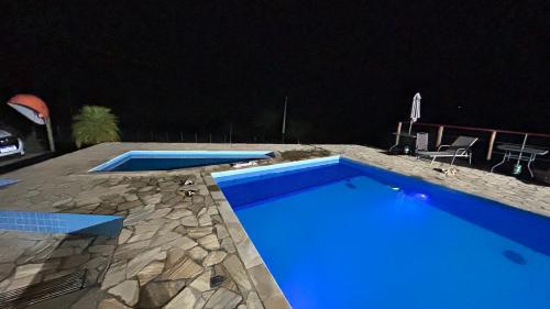 Het zwembad bij of vlak bij Sítio Lopes