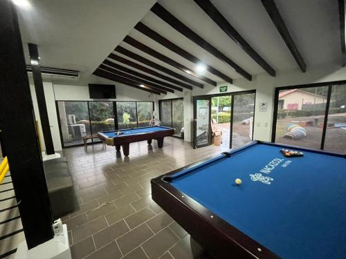 a billiard room with a pool table in a house at Nacazcol - Playas del Coco in Coco