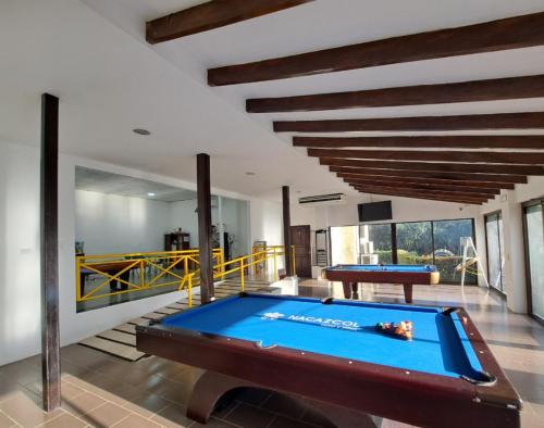 a pool table in the middle of a room at Nacazcol - Playas del Coco in Coco