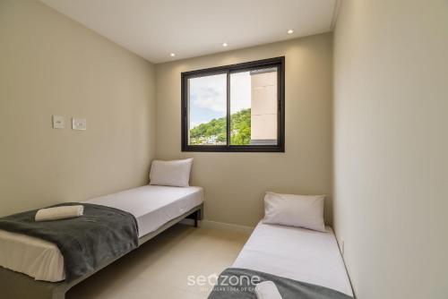Katil atau katil-katil dalam bilik di Apartamento em Praia Brava de Itajaí - PVG0501