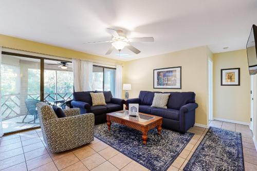 a living room with couches and a table at Turtle Cove 4849 in Kiawah Island