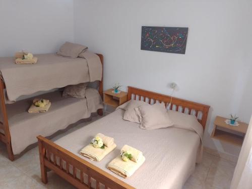 En eller flere senge i et værelse på Hotel El Parque