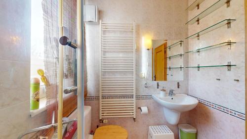 a small bathroom with a sink and a toilet at SAG apartment close to the castle free parking in Bratislava