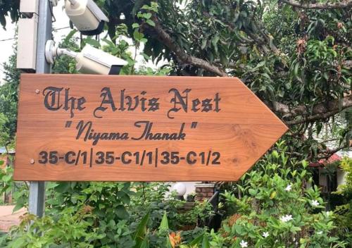 a sign that reads the alpine act in miyazaki ham at The Alvis Nest in Kadawatha