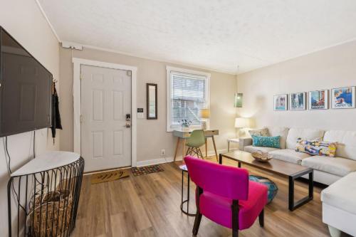 a living room with a couch and a table at Sunny Delight in Nashville