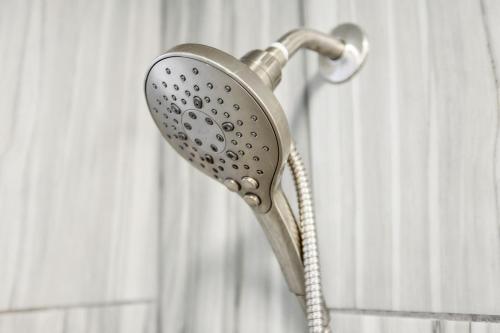 a blow dryer is hanging in a shower at Belmont kings 1 mile to downtown and park free in Nashville