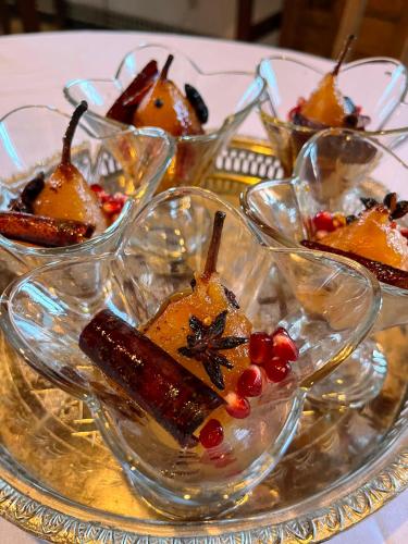 a group of glass bowls filled with desserts on a table at Riad Hanael Garden & Spa in Fès