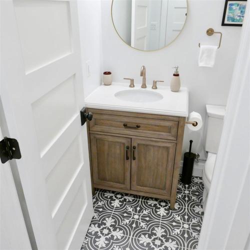 a bathroom with a sink and a mirror at Slumber in Sophistication in Shaw-PKG in Washington, D.C.