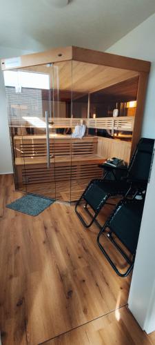 a room with two chairs and a bunk bed at Landhaus Eifelliebe in Wallersheim