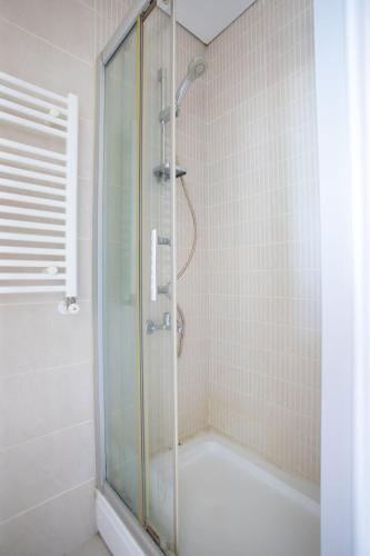 a shower with a glass door in a bathroom at Intimate Suite 1 Bedroom at Center of Atasehir in Istanbul