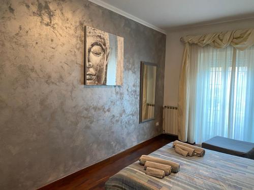 a bedroom with two beds with towels on them at Art & Family Ideal for families in Viareggio