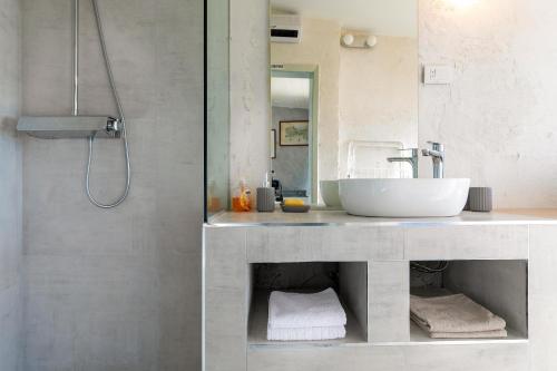 a bathroom with a sink and a shower at Istra Central Corner in Pazin
