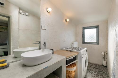 a white bathroom with a sink and a washing machine at Istra Central Corner in Pazin