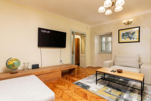 a living room with a flat screen tv on the wall at Istra Central Corner in Pazin