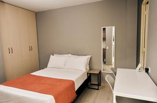 Postel nebo postele na pokoji v ubytování Apartamentos y Loft en Zona Rosa de Laureles