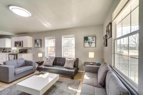 a living room with a couch and a table at Convenient Tulsa Home - 2 Mi to Downtown! in Tulsa