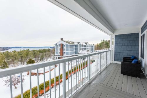 a balcony with a view of the ocean at Bluenose Inn - Bar Harbor Hotel in Bar Harbor