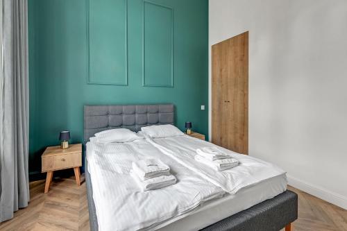 Posteľ alebo postele v izbe v ubytovaní Apartments Waterlane Vintage & by Noclegi Renters