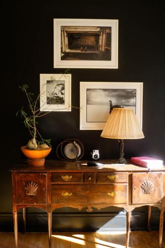 a desk with a lamp on top of it in a room at Object Hotel 2BR Room 2B in Bisbee