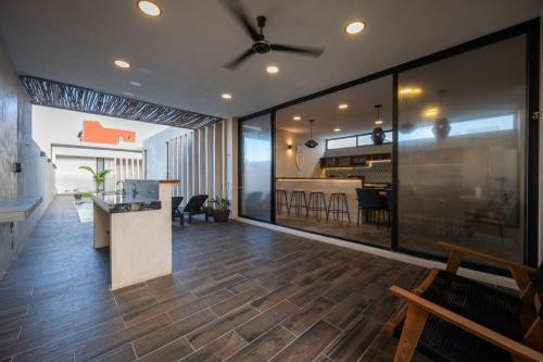 a living room with a kitchen and a dining room at Casa en San Benito a steps away from the beach in San Benito