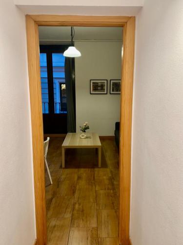 a view of a hallway with a table and a room at Madrid Room Sol Center in Madrid