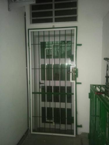 a door with a metal gate in a building at Globe trotter vision D in Cotonou