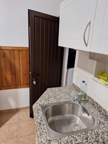 a kitchen with a sink and a counter top at Monteverde in Monte Negro