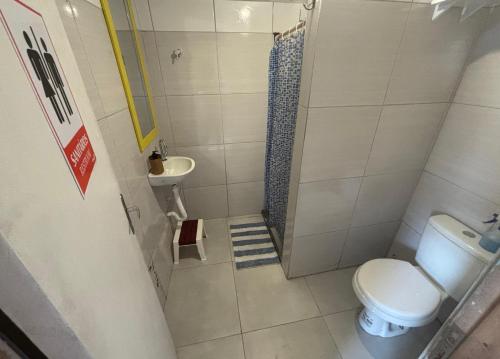 a small bathroom with a toilet and a sink at Zili Pernambuco - Hostel Pousada in Recife