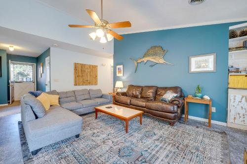 a living room with a couch and a table at Pet-Friendly Wilmington Home with Fenced Yard! in Wilmington